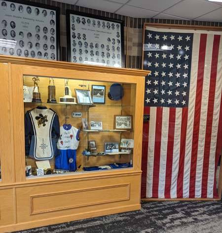 Display case of band items and flag