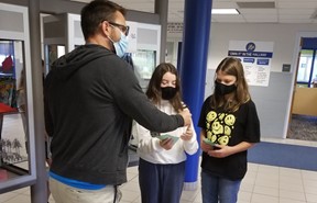 Students using their Bee Bucks at the Own It Store