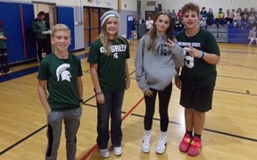 Students participating in MSU verses UofM assembly.