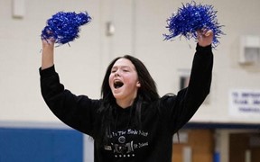 Student Cheering for the basketball team.
