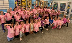 Youth Cheerleaders in pink shirts