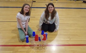 Students making cup castle at Fun in the Sun Assembly