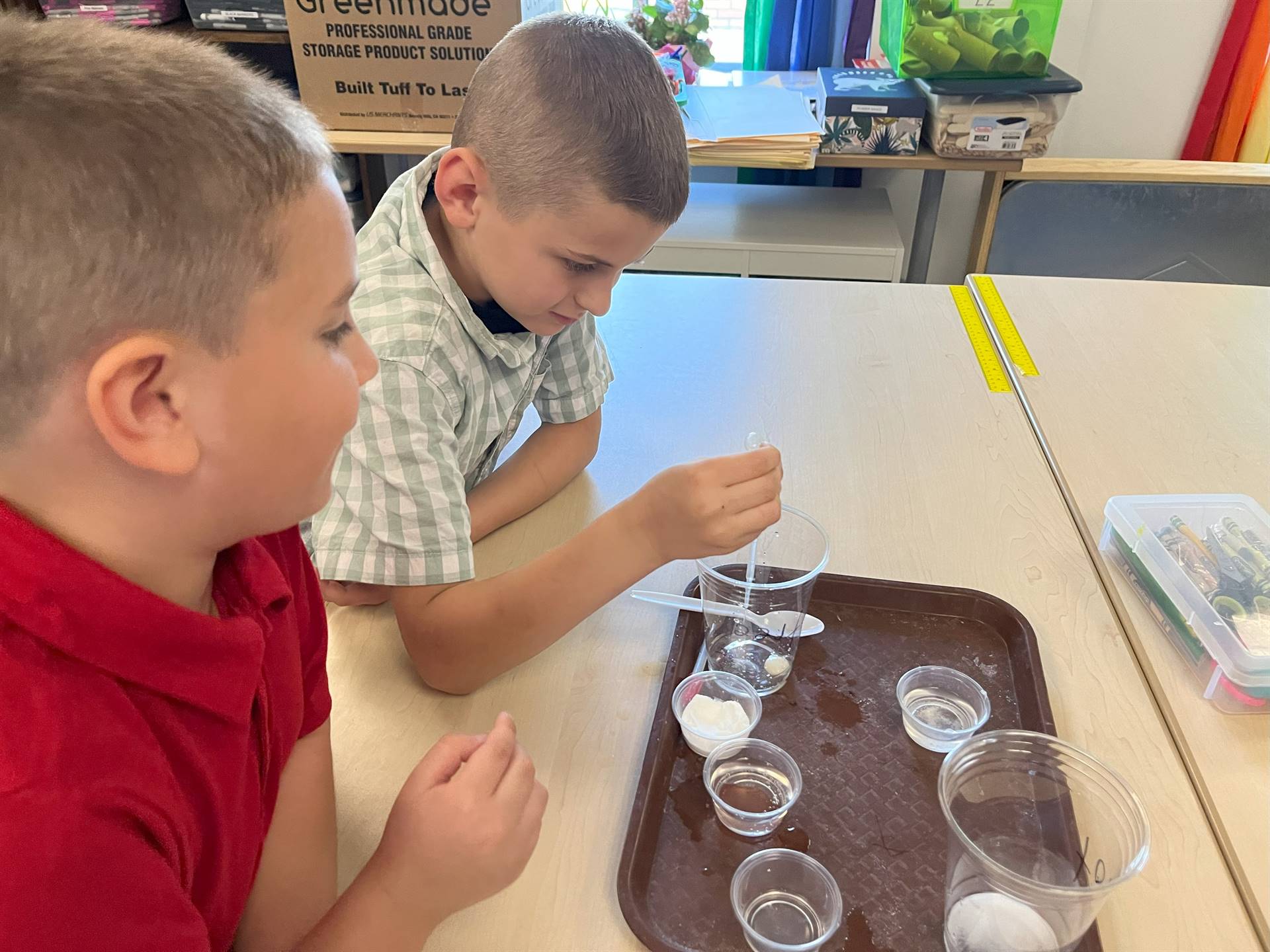 Students looking at experiment
