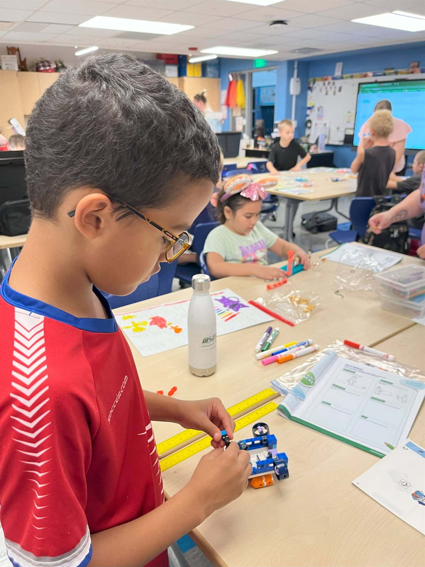 Student building with legos